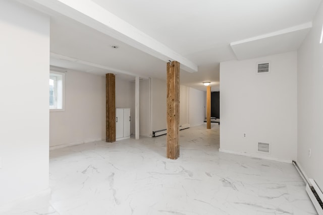 basement featuring a baseboard radiator, marble finish floor, and visible vents