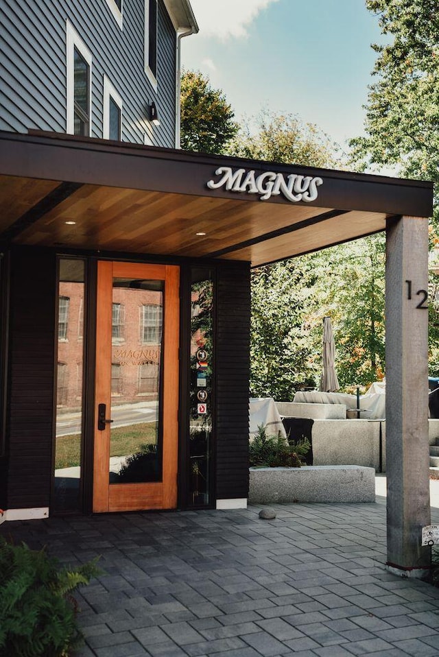 property entrance featuring a patio