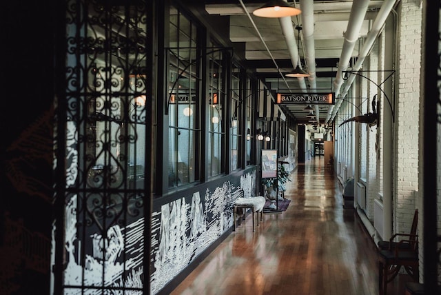 corridor featuring wood finished floors