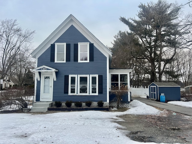 view of front of home with a shed and an outbuilding