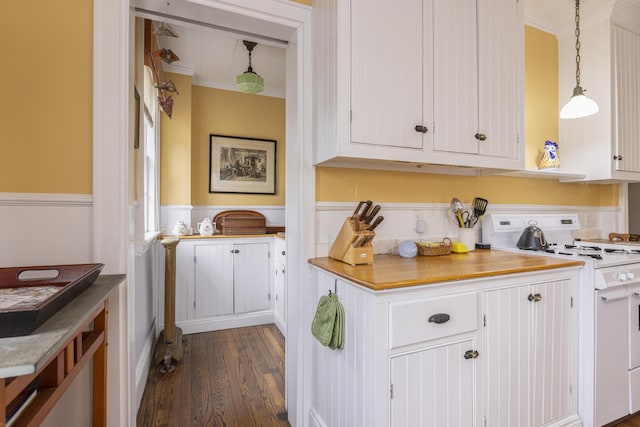 kitchen with ornamental molding, white gas range oven, and white cabinets