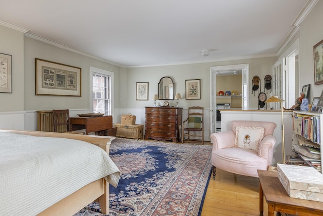bedroom featuring crown molding and hardwood / wood-style flooring