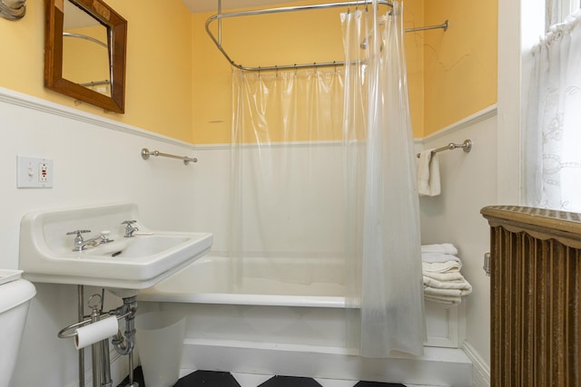 bathroom with toilet and shower / bath combo