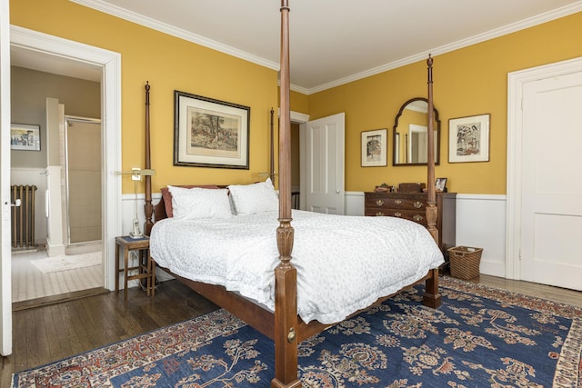 bedroom featuring wood-type flooring, radiator, crown molding, and wainscoting