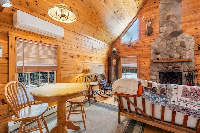 dining area featuring a wall mounted AC, a fireplace, wood walls, wooden ceiling, and a notable chandelier