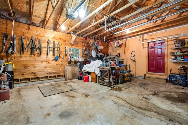 garage featuring a workshop area and a garage door opener