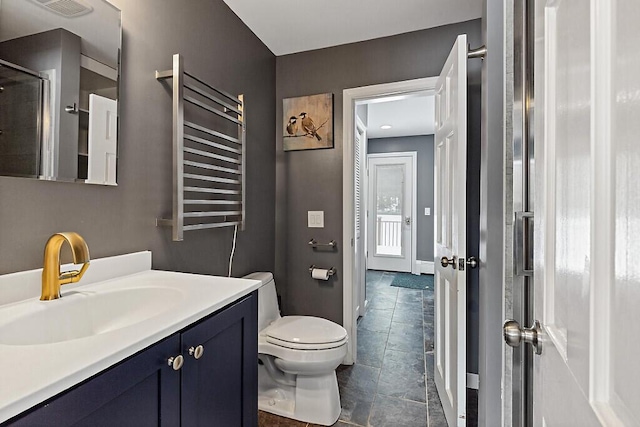 full bathroom with baseboards, radiator, a shower with door, toilet, and vanity