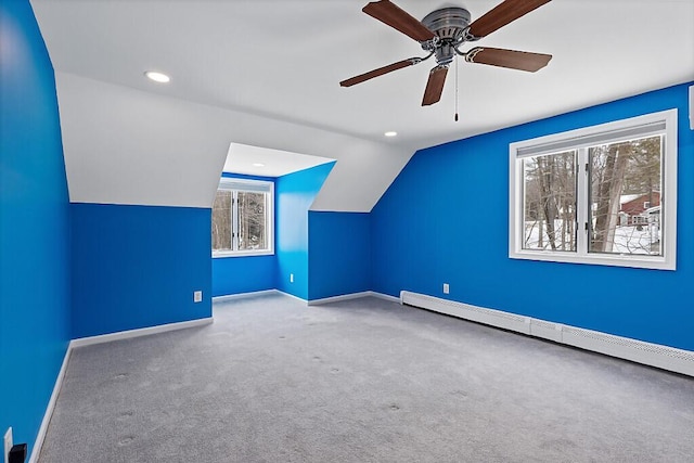 bonus room featuring baseboards, lofted ceiling, baseboard heating, carpet flooring, and recessed lighting