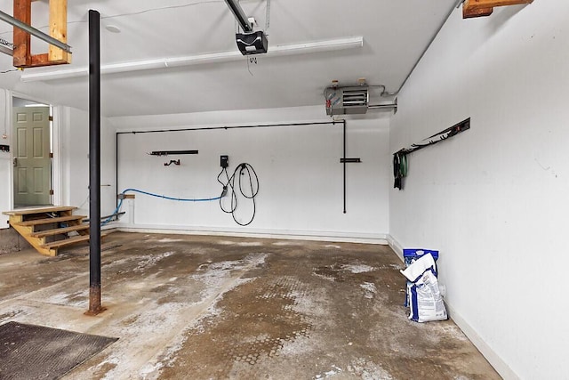 garage featuring baseboards and a garage door opener