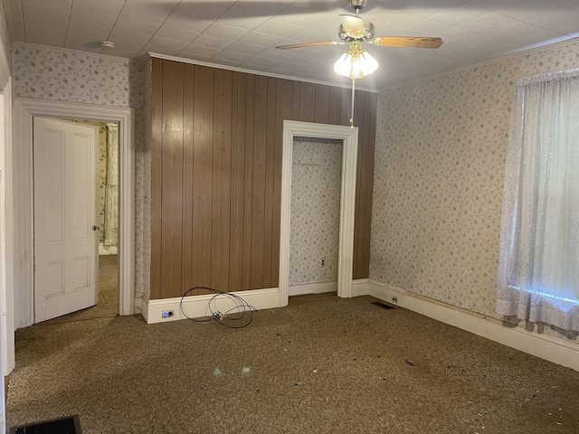 48 Gay St, Rockland, ME 04841 - carpeted spare room featuring wallpapered walls, a ceiling fan, visible vents, and ornamental molding