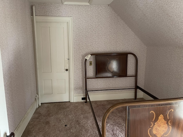 48 Gay St, Rockland, ME 04841 - unfurnished bedroom featuring wallpapered walls, lofted ceiling, and carpet floors