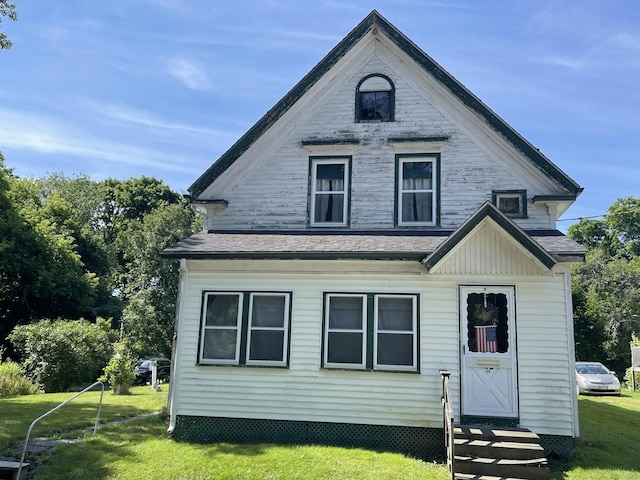 48 Gay St, Rockland, ME 04841 - view of front of property with a shingled roof, a front yard, and entry steps