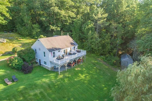 drone / aerial view with a view of trees