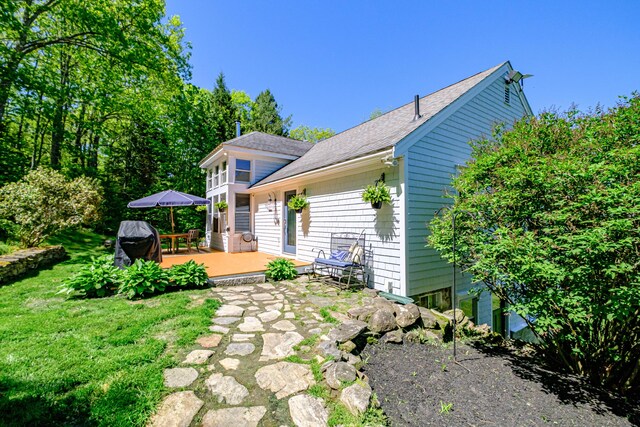 543 Middle Rd, Dresden, ME 04342 - back of house with a wooden deck, a shingled roof, and a yard