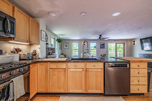 543 Middle Rd, Dresden, ME 04342 - kitchen featuring appliances with stainless steel finishes, a sink, light wood-style floors, healthy amount of natural light, and recessed lighting