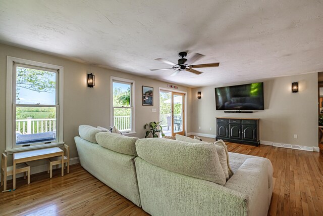 543 Middle Rd, Dresden, ME 04342 - living area with baseboards, a ceiling fan, and wood-type flooring