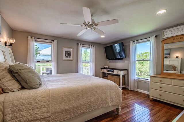 543 Middle Rd, Dresden, ME 04342 - bedroom with multiple windows, dark wood-style floors, recessed lighting, ceiling fan, and baseboards