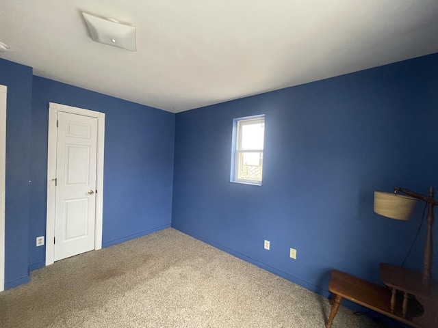 unfurnished room with carpet