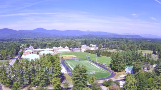 bird's eye view with a mountain view and a wooded view