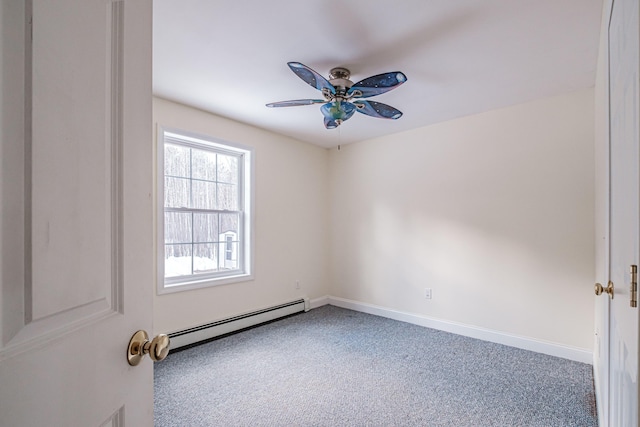 empty room featuring a baseboard heating unit, carpet floors, baseboards, and a ceiling fan