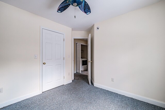 unfurnished bedroom with carpet floors, ceiling fan, and baseboards