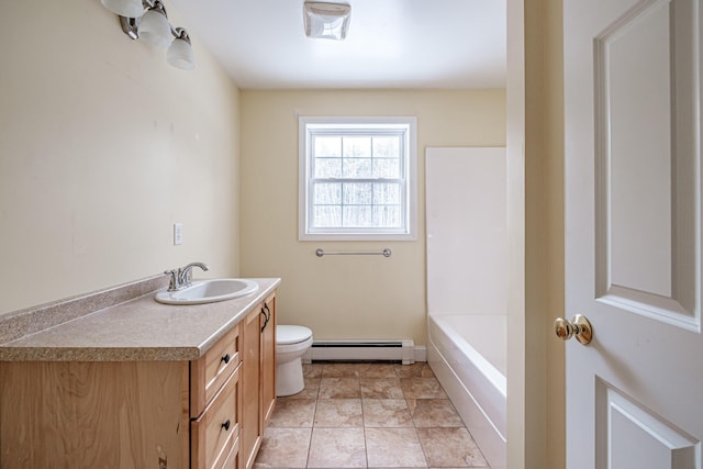 bathroom featuring toilet, a baseboard radiator, tile patterned flooring, a washtub, and vanity