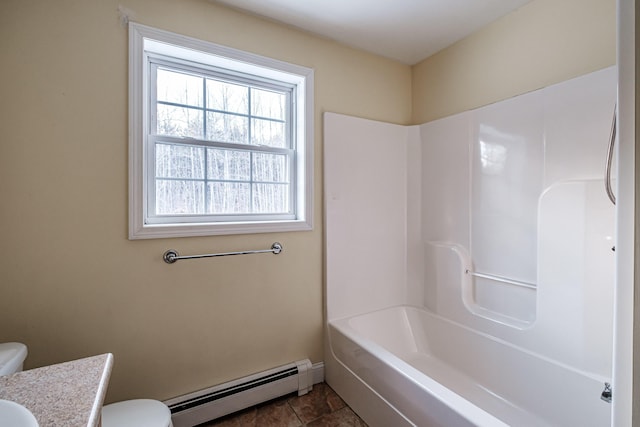 full bathroom featuring toilet, baseboards, a baseboard heating unit, and vanity