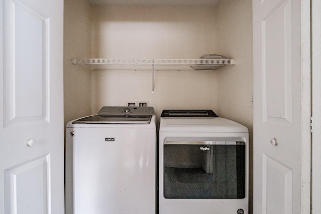 laundry area featuring laundry area and washer and clothes dryer