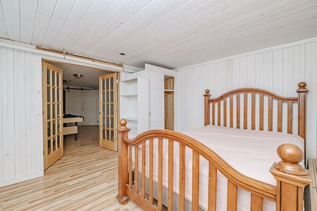 bedroom featuring wooden ceiling and wood finished floors