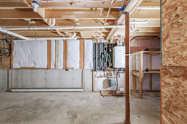 unfinished basement with tankless water heater and baseboard heating