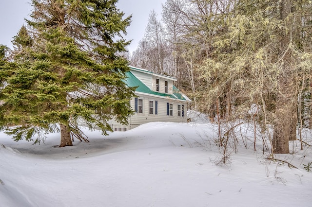 view of front of house featuring metal roof