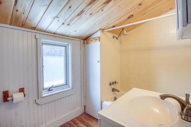 full bath featuring lofted ceiling, wooden ceiling, shower / tub combination, wood finished floors, and a sink