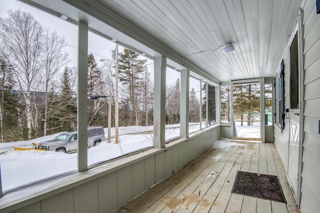 unfurnished sunroom featuring wood ceiling