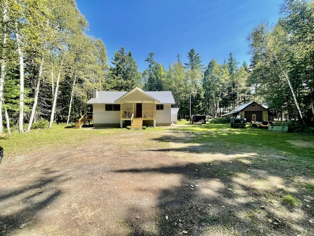 view of front of house featuring metal roof