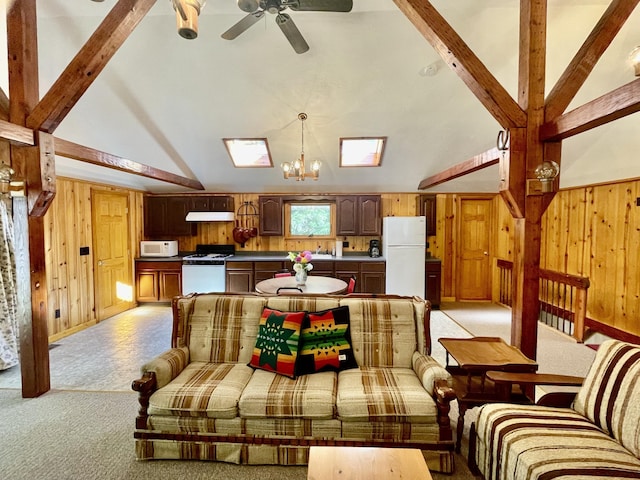 interior space featuring light carpet, wooden walls, high vaulted ceiling, and beam ceiling