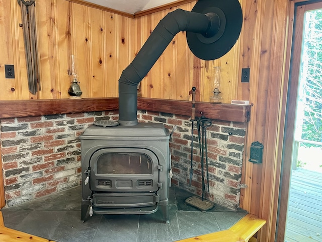 room details with a wood stove and wood walls