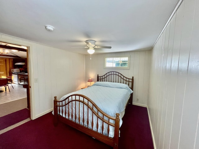 bedroom with baseboards and a ceiling fan