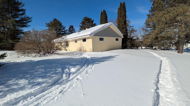 view of snow covered property