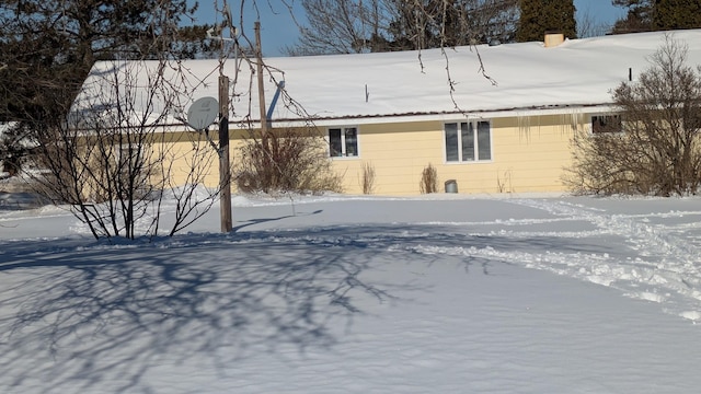 view of snow covered house