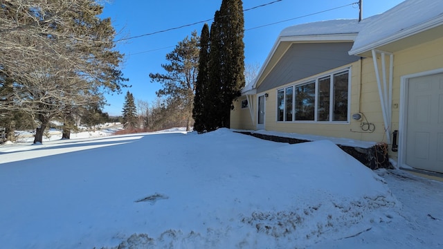 view of yard covered in snow