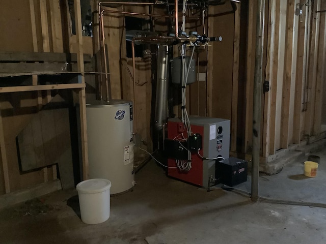 utility room featuring a heating unit and electric water heater