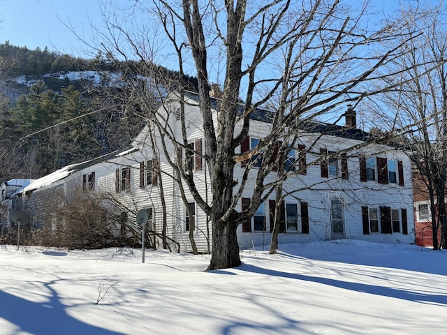 view of front of house with a chimney