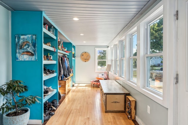 mudroom featuring light wood-type flooring and baseboards