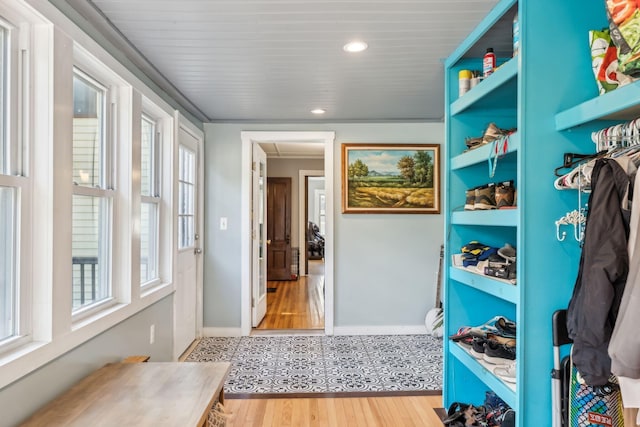 mudroom with recessed lighting, baseboards, and wood finished floors