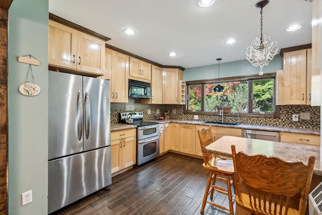 kitchen with backsplash, light brown cabinetry, appliances with stainless steel finishes, dark wood-type flooring, and a sink