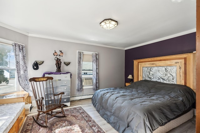 bedroom featuring a baseboard radiator, cooling unit, crown molding, and light wood finished floors