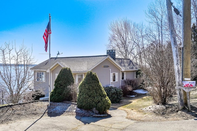 view of side of property featuring a chimney