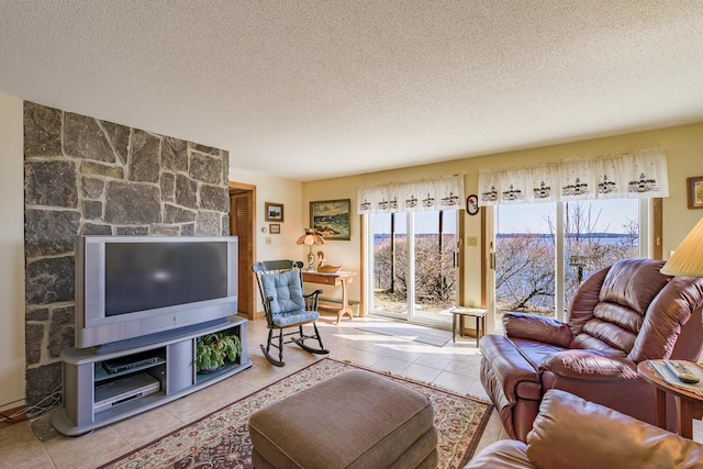 living room featuring a textured ceiling and tile patterned flooring