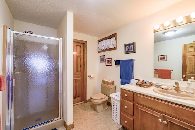 full bath with vanity, baseboards, a shower stall, a textured ceiling, and toilet