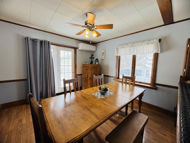 dining space with ornamental molding, a wall mounted AC, ceiling fan, and wood finished floors